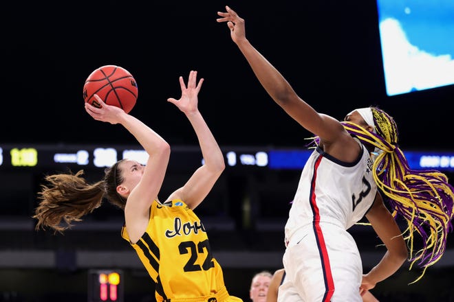 Iowa's Caitlin Clark (22) puts up a shot against UConn's Aaliyah Edwards (3) during the first half in the Sweet 16 round of the NCAA Women's Basketball Tournament at the Alamodome on March 27, 2021 in San Antonio, Texas.