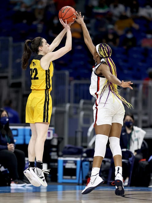 Iowa's Caitlin Clark (22) takes a shot as UConn's Aaliyah Edwards (3) defends in the first half during the Sweet 16 round of the NCAA Women's Basketball Tournament at the Alamodome on March 27, 2021 in San Antonio, Texas.