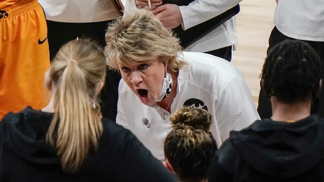 Iowa head coach Lisa Bluder talks to her players during the first half of an NCAA college basketball game against UConn in the Sweet 16 round of the Women's NCAA tournament Saturday, March 27, 2021, at the Alamodome in San Antonio.