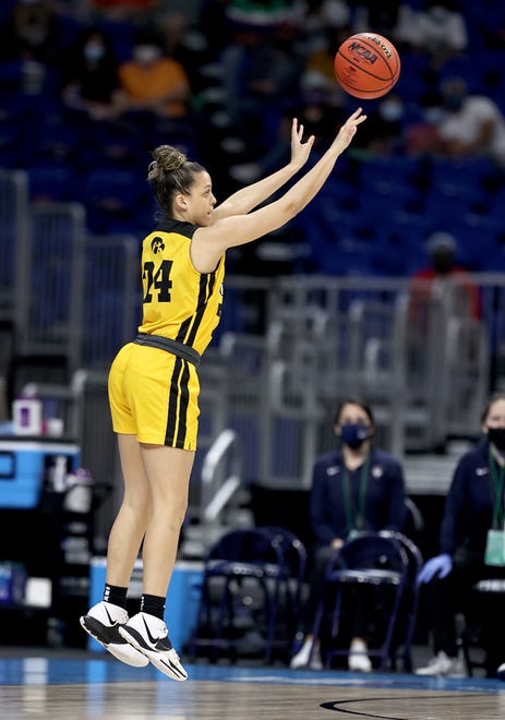Iowa's Gabbie Marshall (24) shoots a 3-point shot in the first half against the UConn Huskies during the Sweet 16 round of the NCAA Women's Basketball Tournament at the Alamodome on March 27, 2021 in San Antonio, Texas.