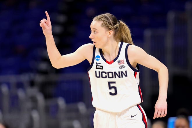 UConn's Paige Bueckers (5) reacts to a basket against the Iowa Hawkeyes during the first half in the Sweet 16 round of the NCAA Women's Basketball Tournament at the Alamodome on March 27, 2021 in San Antonio, Texas.