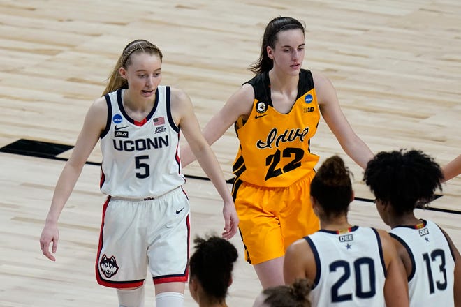 UConn guard Paige Bueckers (5) and Iowa guard Caitlin Clark (22) walk off the court after their college basketball game in the Sweet Sixteen round of the women's NCAA tournament at the Alamodome in San Antonio, Saturday, March 27, 2021.