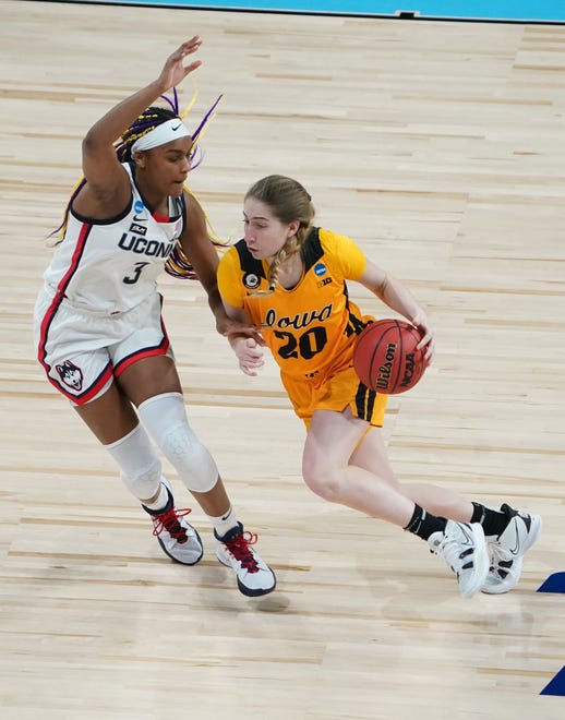 Iowa Hawkeyes guard Kate Martin (20) drives against Connecticut Huskies forward Aaliyah Edwards (3) in the Sweet 16 of the 2021 Women's NCAA Tournament, March 27, 2021, at Alamodome.
