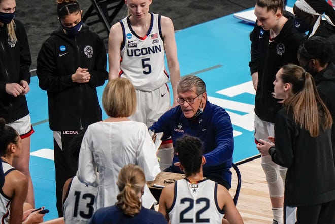 UConn head coach Geno Auriemma talks to his players during the first half of an NCAA college basketball game against Iowa in the Sweet 16 round of the Women's NCAA tournament Saturday, March 27, 2021, at the Alamodome in San Antonio.