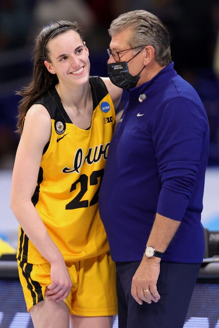 UConn head coach Geno Auriemma talks with Iowa guard Caitlin Clark (22) after the Huskies' 92-72 win in the Sweet 16 round of the NCAA Women's Basketball Tournament at the Alamodome on March 27, 2021 in San Antonio, Texas.