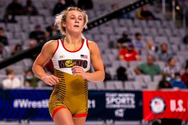 Felicity Taylor runs off the mat after her victory at 53 kg during the first session of the USA Wrestling Olympic Trials, Friday, April 2, 2021, at Dickies Arena in Fort Worth, Texas.