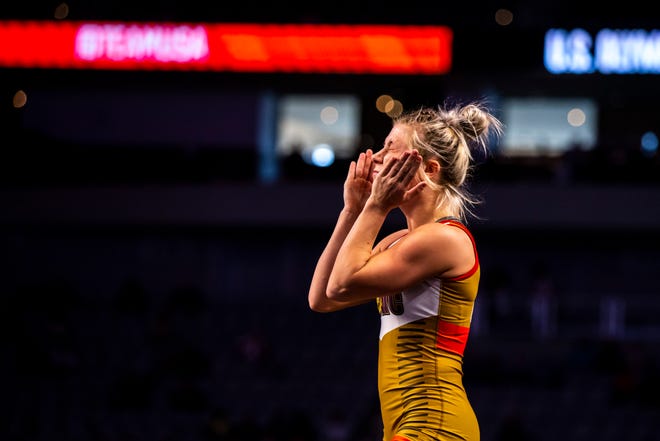 Felicity Taylor smacks her face before wrestling at 53 kg during the first session of the USA Wrestling Olympic Trials, Friday, April 2, 2021, at Dickies Arena in Fort Worth, Texas.
