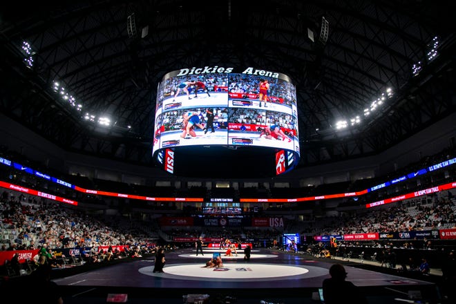 Action from all four mats are shown on the screen during the second session of the USA Wrestling Olympic Team Trials, Friday, April 2, 2021, at Dickies Arena in Fort Worth, Texas.