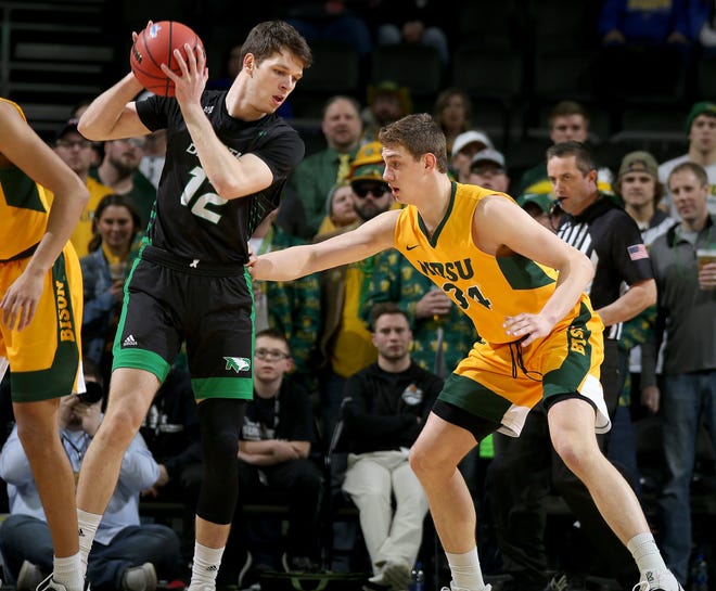 SIOUX FALLS, SD - MARCH 10: Filip Rebraca #12 of the North Dakota Fighting Hawks looks to make a move against Rocky Kreuser #34 of the North Dakota State Bison during the menâ€™s championship game at the 2020 Summit League Basketball Tournament in Sioux Falls, SD. (Photo by Dave Eggen/Inertia)

Summit League Basketball Tournament