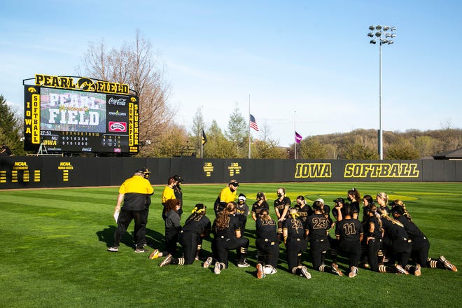 Iowa Hawkeyes head coach Renee Gillispie talks with players as they huddle up in the outfield after a NCAA Big Ten Conference softball game against Northwestern, Saturday, April 17, 2021, at Bob Pearl Field in Iowa City, Iowa.