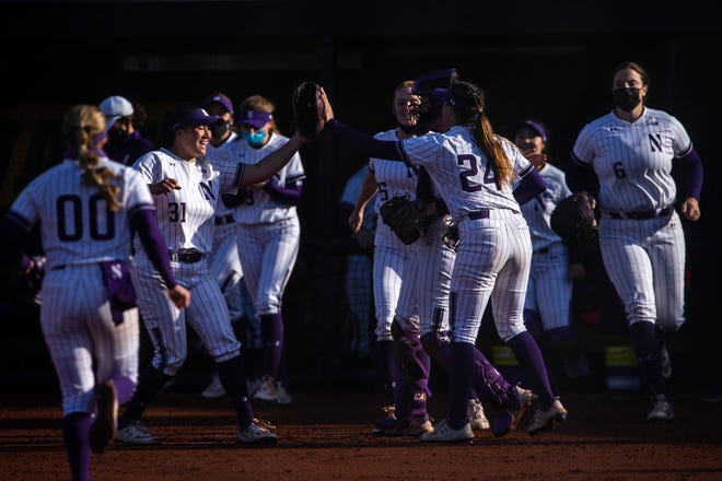 Northwestern pitcher Danielle Williams (24) celebrates with teammates after throwing a strikeout during a NCAA Big Ten Conference softball game against Iowa, Saturday, April 17, 2021, at Bob Pearl Field in Iowa City, Iowa.
