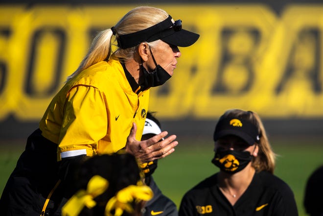 Iowa Hawkeyes head coach Renee Gillispie talks with players in the outfield after a NCAA Big Ten Conference softball game against Northwestern, Saturday, April 17, 2021, at Bob Pearl Field in Iowa City, Iowa.