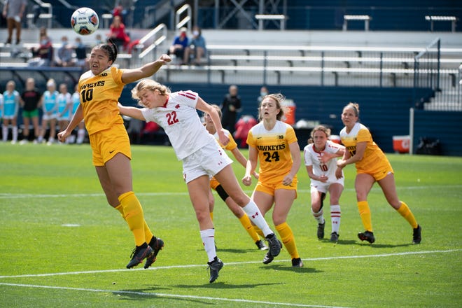 Iowa Defender Aleisha Ganief (10) heads the ball away from goal during an NCAA college soccer game in the final of the Big Ten Conference tournament, Sunday, April 17, 2021, in State College, Pennsylvania.