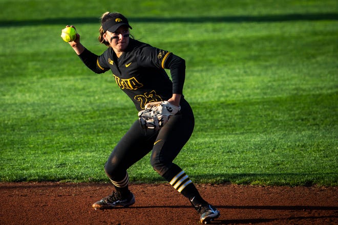Iowa's Grace Banes (23) fields a ball during a NCAA Big Ten Conference softball game against Northwestern, Saturday, April 17, 2021, at Bob Pearl Field in Iowa City, Iowa.