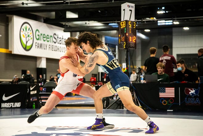 Adrian Lenz, left, wrestles Robert Weston at 72 kg during the UWW Junior and Senior national Greco-Roman wrestling championships, Friday, April 30, 2021, at the GreenState Family Fieldhouse in Coralville, Iowa.
