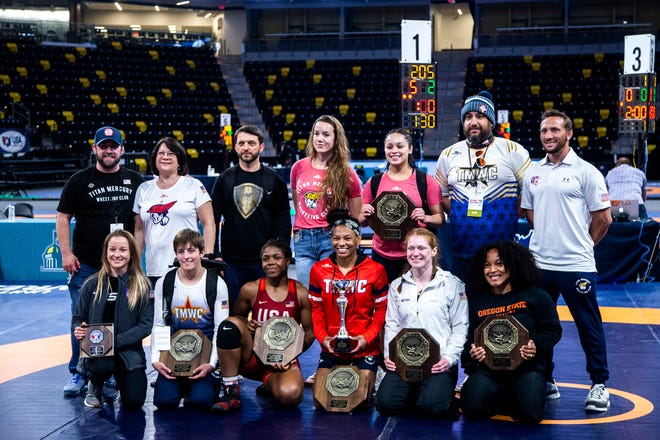 Members of the Titan Mercury Wrestling Club women's freestyle team pose for a photo, Friday, April 30, 2021, at the Xtream Arena in Coralville, Iowa.