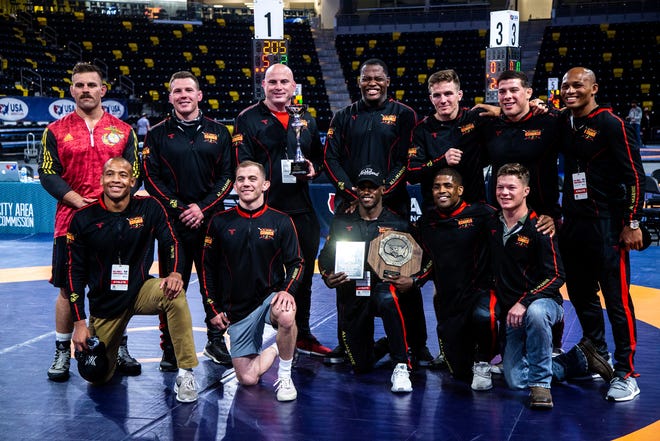 Members of the All-Marine Wrestling Team pose for a photo after the UWW Senior national Greco-Roman wrestling championships, Friday, April 30, 2021, at the Xtream Arena in Coralville, Iowa.