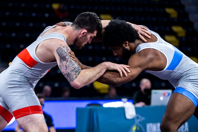Willie Miklus, left, wrestles Cameron Caffey at 92 kg during the UWW Senior National freestyle championships, Saturday, May 1, 2021, at the Xtream Arena in Coralville, Iowa.