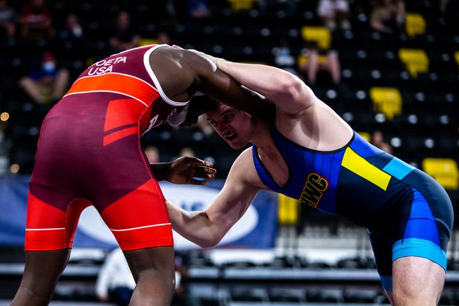 Zach Glazier, right, wrestles Isiah Pettigrew at 92 kg during the UWW Junior National freestyle championships, Saturday, May 1, 2021, at the Xtream Arena in Coralville, Iowa.