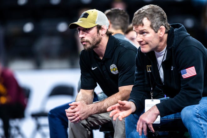 Hawkeye Wrestling Club coach Dan Dennis, left, and advisor Tom Brands watch a match during the UWW Junior National freestyle championships, Saturday, May 1, 2021, at the Xtream Arena in Coralville, Iowa.