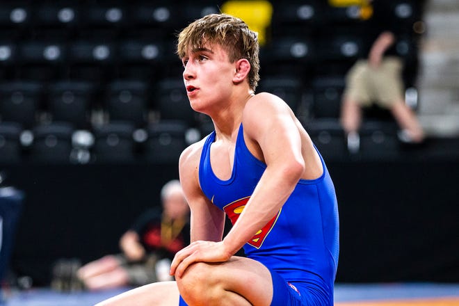 Drake Ayala looks up at the time clock during a match at 57 kg during the UWW Junior National freestyle championships, Saturday, May 1, 2021, at the Xtream Arena in Coralville, Iowa.