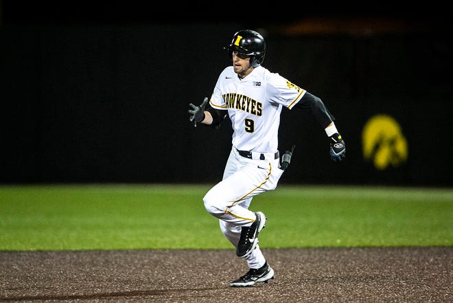 Iowa's Ben Norman (9) rounds first base during a NCAA Big Ten Conference baseball game against Illinois, Friday, May 14, 2021, at Duane Banks Field in Iowa City, Iowa.