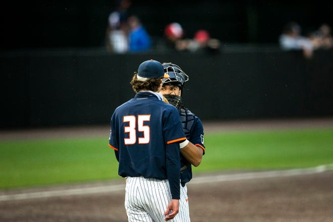 Illinois catcher Ryan Hampe, right, talks with pitcher 	Andrew Hoffmann (35) during a NCAA Big Ten Conference baseball game against Iowa, Friday, May 14, 2021, at Duane Banks Field in Iowa City, Iowa.