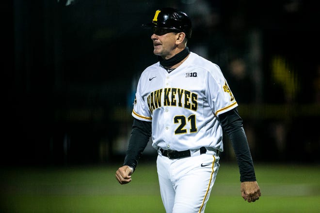 Iowa head coach Rick Heller walks out to the coaching box during a NCAA Big Ten Conference baseball game against Illinois, Friday, May 14, 2021, at Duane Banks Field in Iowa City, Iowa.
