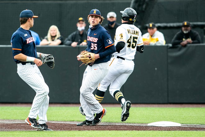 Illinois pitcher Andrew Hoffmann (35) gets an out at first base against Iowa's Peyton Williams (45) during a NCAA Big Ten Conference baseball game, Friday, May 14, 2021, at Duane Banks Field in Iowa City, Iowa.