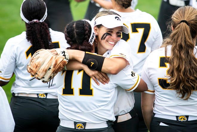 Iowa's Sammy Diaz embraces teammate Avery Guy (11) after a NCAA Big Ten Conference softball game against Illinois, Sunday, May 16, 2021, at Bob Pearl Field in Iowa City, Iowa.