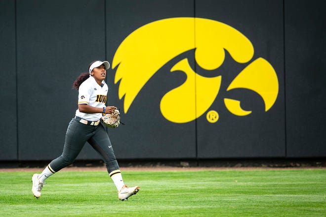 Iowa's Nia Carter (14) runs in the outfield during a NCAA Big Ten Conference softball game against Illinois, Sunday, May 16, 2021, at Bob Pearl Field in Iowa City, Iowa.