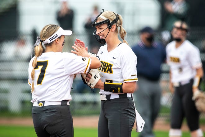 Iowa's Sammy Diaz (7) talks with pitcher Allison Doocy during a NCAA Big Ten Conference softball game against Illinois, Sunday, May 16, 2021, at Bob Pearl Field in Iowa City, Iowa.