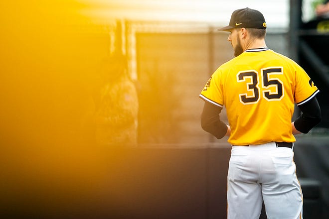 Iowa pitcher Cam Baumnn (35) looks over his shoulder during a NCAA Big Ten Conference baseball game against Illinois, Sunday, May 16, 2021, at Duane Banks Field in Iowa City, Iowa.