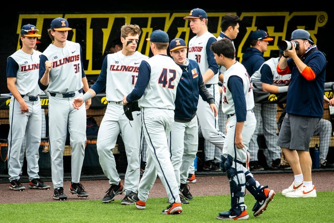 Illinois pitcher Riley Gowens (42) is greeted by teammates after closing out an inning during a NCAA Big Ten Conference baseball game against Iowa, Sunday, May 16, 2021, at Duane Banks Field in Iowa City, Iowa.