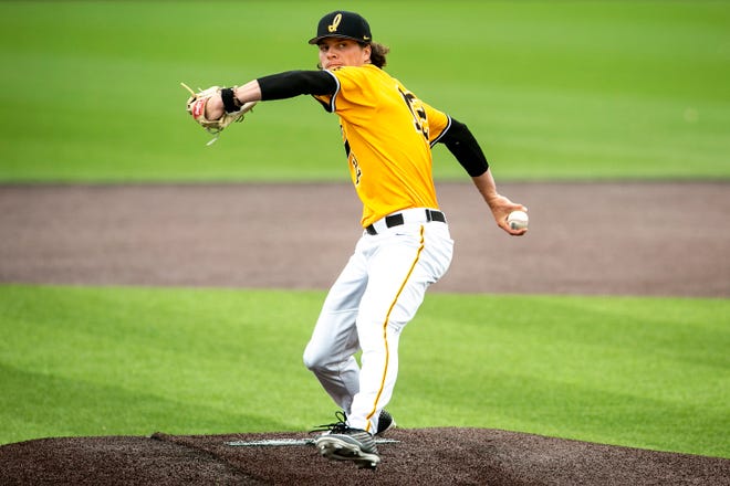 Iowa's Drew Irvine (12) delivers a pitch during a NCAA Big Ten Conference baseball game against Illinois, Sunday, May 16, 2021, at Duane Banks Field in Iowa City, Iowa.