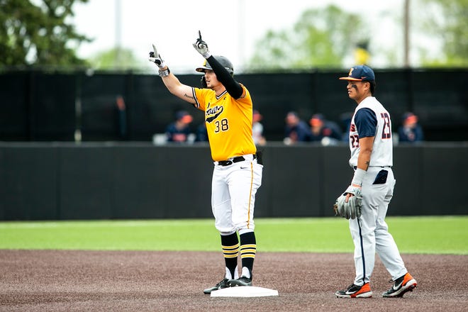 Iowa's Trenton Wallace (38) celebrates on second base as Illinois' Branden Comia, right, looks on during a NCAA Big Ten Conference baseball game, Sunday, May 16, 2021, at Duane Banks Field in Iowa City, Iowa.