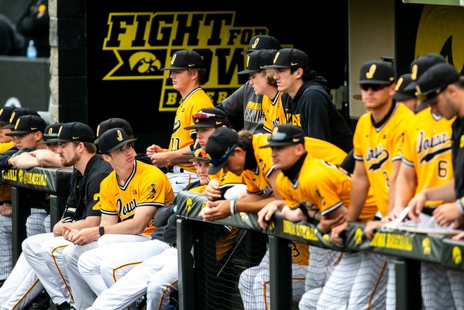 Iowa Hawkeyes players look on from the dugout during a NCAA Big Ten Conference baseball game against Illinois, Sunday, May 16, 2021, at Duane Banks Field in Iowa City, Iowa.