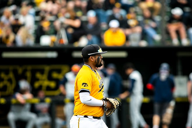 Iowa's Izaya Fullard (20) walks out to first base during a NCAA Big Ten Conference baseball game against Illinois, Sunday, May 16, 2021, at Duane Banks Field in Iowa City, Iowa.