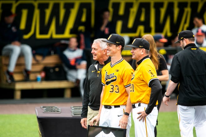 Iowa athletic director Gary Barta, left, Iowa's Jack Dreyer (33) and Iowa head coach Rick Heller pose for a photo on senior day before a NCAA Big Ten Conference baseball game against Illinois, Sunday, May 16, 2021, at Duane Banks Field in Iowa City, Iowa.
