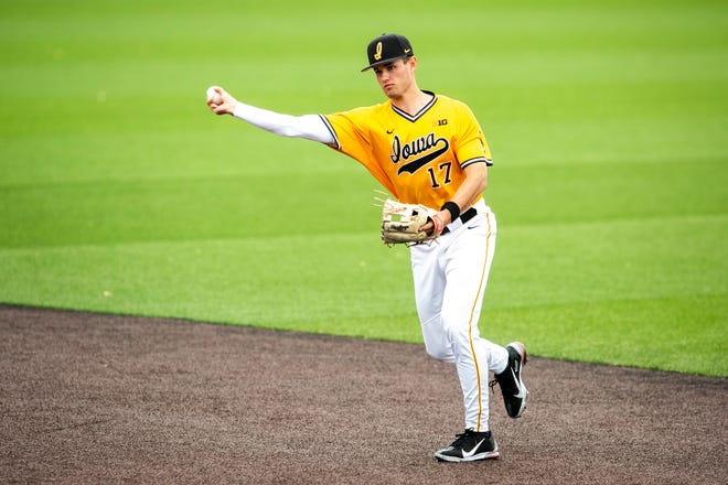 Iowa's Dylan Nedved (17) fields a ball during a NCAA Big Ten Conference baseball game against Illinois, Sunday, May 16, 2021, at Duane Banks Field in Iowa City, Iowa.