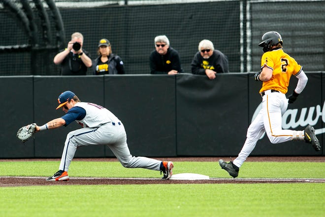 Illinois' Kellen Sarver, left, gets an out at first base ahead of Iowa's Brendan Sher (2) during a NCAA Big Ten Conference baseball game, Sunday, May 16, 2021, at Duane Banks Field in Iowa City, Iowa.