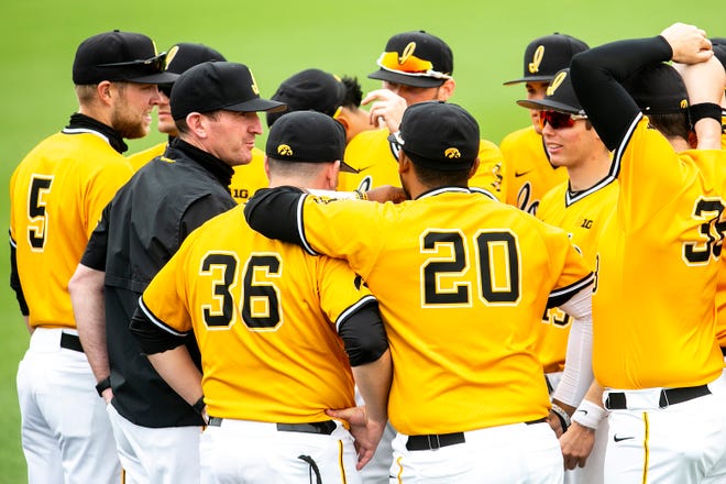 Iowa associate head coach Marty Sutherland huddles up with players before a NCAA Big Ten Conference baseball game against Illinois, Sunday, May 16, 2021, at Duane Banks Field in Iowa City, Iowa.