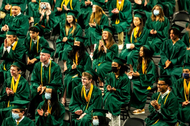 Soon-to-be graduates listen to a speech during the graduation Commencement Ceremony for Iowa City West High School, Sunday, June 6, 2021, at the Xtream Arena in Coralville, Iowa.