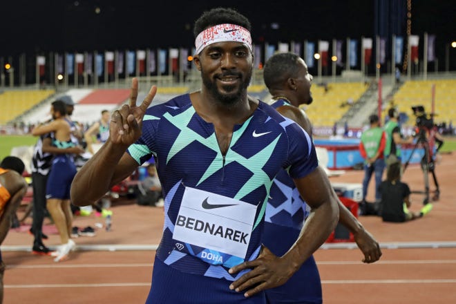US Kenny Bednarek celebrates after winning the Men's 200m final during the Diamond League athletics meeting at the Qatar Sports Club stadium in the capital Doha on May 28, 2021. (Photo by KARIM JAAFAR / AFP) (Photo by KARIM JAAFAR/AFP via Getty Images)