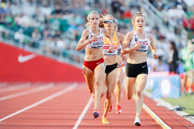Karissa Schweizer, left, and Elise Cranny compete in the women's 5000 meter final during day four of the 2020 U.S. Olympic Track & Field Team Trials at Hayward Field on June 21, 2021 in Eugene, Oregon.