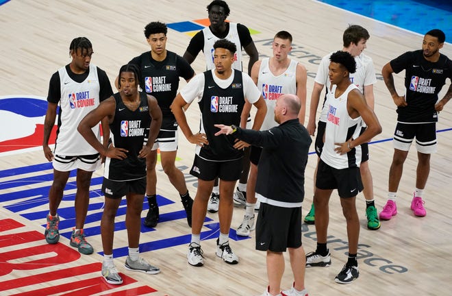 Iowa's Joe Wieskamp, fourth from right, stands with other prospects participating in the NBA Draft Combine Tuesday, June 22, 2021, at the Wintrust Arena in Chicago.