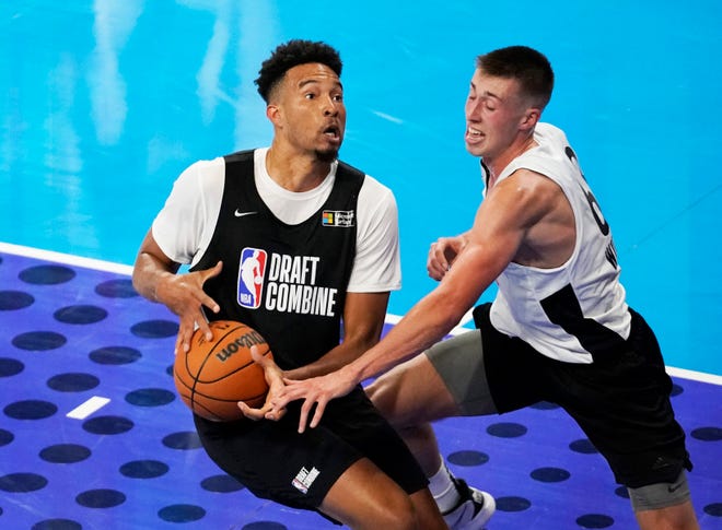 University of Southern California's Isaiah Mobley, left, drives against Iowa's Joe Wieskamp while participating in the NBA Draft Combine Tuesday, June 22, 2021, at the Wintrust Arena in Chicago.