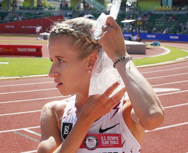 Karissa Schweizer cools down with a bag of ice before the start of the women's 10,000 meters during the U.S. Olympic Track and Field Trials at Hayward Field.