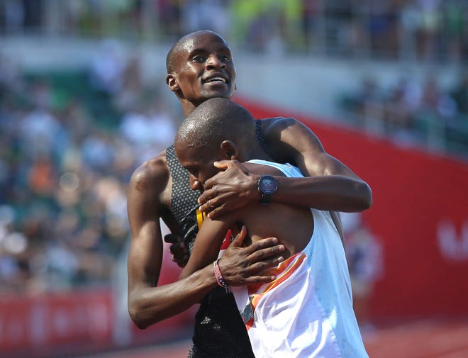 Benard Keter, left, running for Army, embraces Hillary Bor at the finish of the men's steeplechase during the U.S. Olympic Track and Field Trials at Hayward Field.
