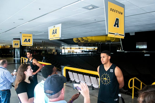 Iowa forward Kris Murray, left, talks with reporters as his twin brother Iowa forward Keegan Murray (15) does the same during a summer Hawkeyes men's basketball media availability, Tuesday, June 29, 2021, at Carver-Hawkeye Arena in Iowa City, Iowa.